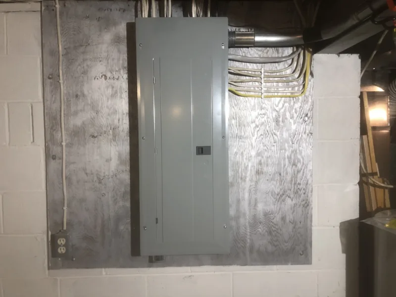 After: the same wall with a new panel and every cable run straight and clipped