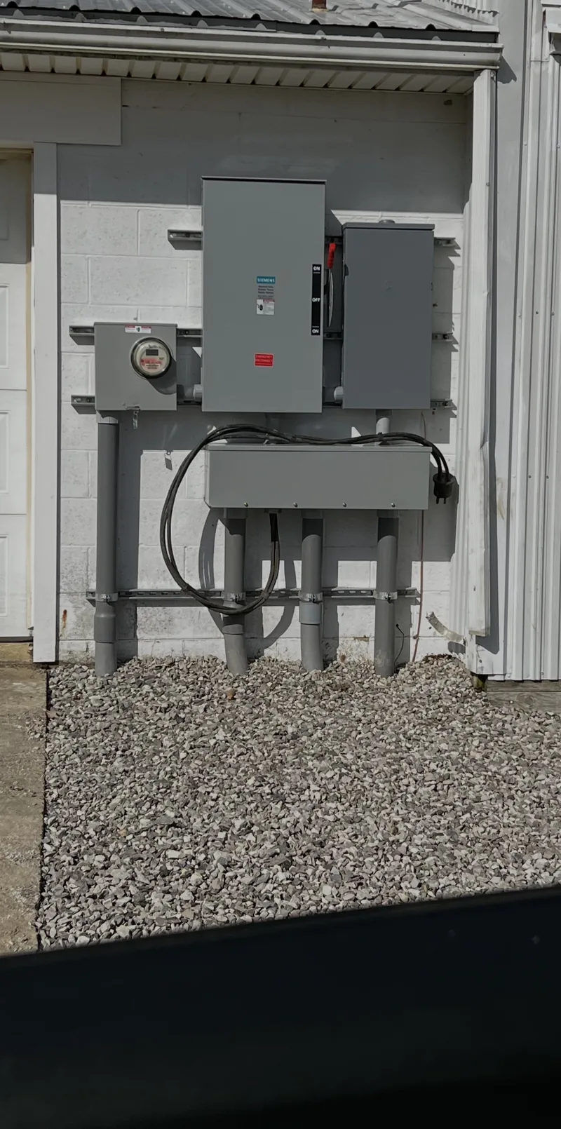 The finished service on the outside of a metal building