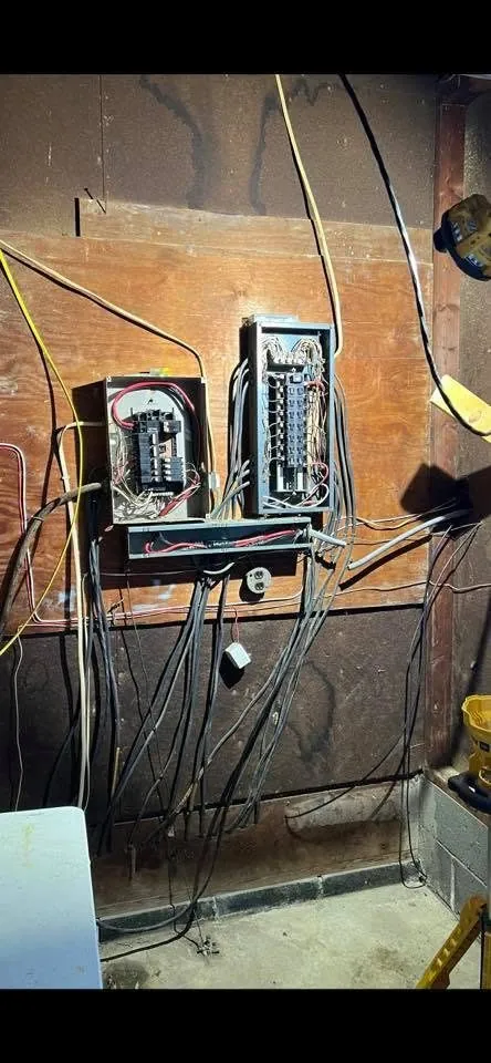 Electrical panel with conduit runs in a basement