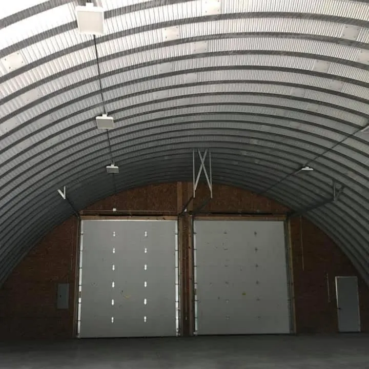 Steel building interior lit with LED high bays by DC Electric